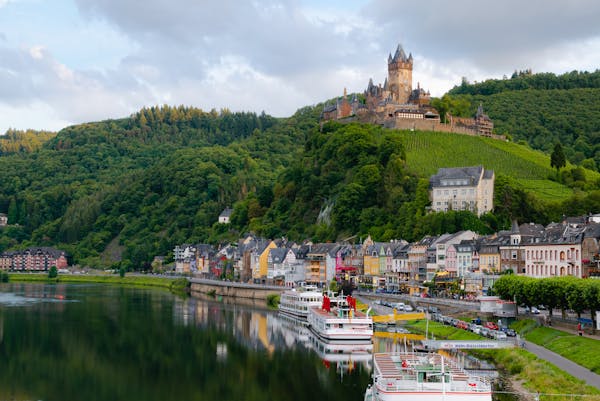 Photo by Kai Pilger Idyllic landscape of Cochem Castle overlooking Moselle River in Germany.